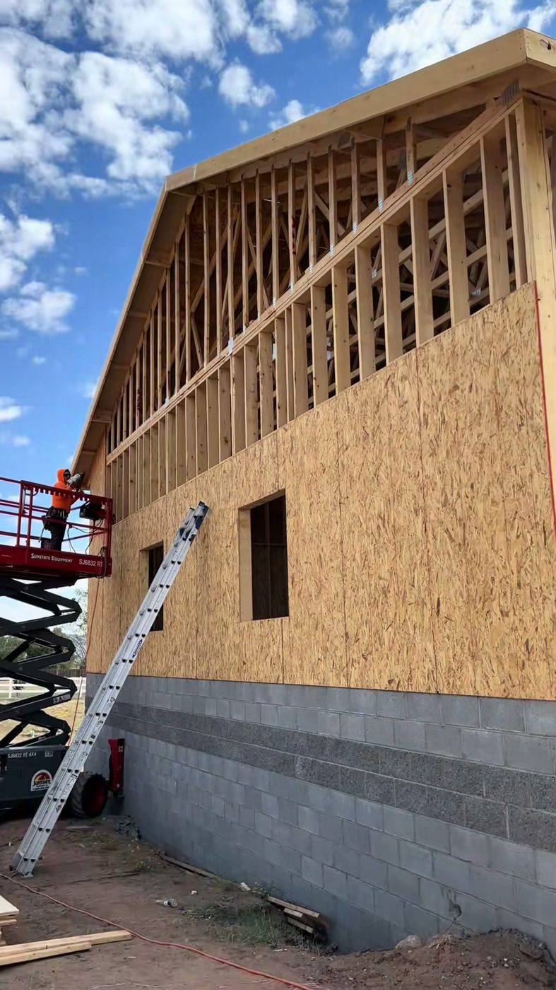 Commercial building exterior framing with scissor lift in Northern Arizona